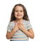 Cute grateful little girl with hands on chest, white