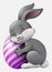 Cute grey Easter Bunny hugged egg decorated isolated on a white background