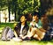 Cute group of teenages at the building of university with books