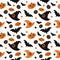 Cute halloween seamless pattern with pumpkins, witch hats, bats and candys
