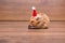The cute hamster with santa hat on the table