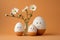 Cute handmade eggs with funny faces and spring flowers on light background. Happy Easter