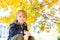 Cute handsome smiling little boy portrait. Stylish boy enjoying colourful autumn park. Autumn season. Healthy and happy childhood.