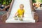 Cute happy 2 year old boy riding slide in an outdoor playground on vacation