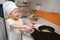 Cute happy Asian boy having fun cooking breakfast in kitchen, Fun indoor activities for kindergarten kids, Stay home Stay safe