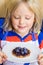 Cute, happy child eating a homemade healthy snack