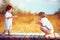 Cute happy kids, brothers playing together on summer field