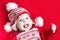 Cute happy laughing baby girl in Christmas dress a