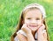 Cute happy little girl on the meadow