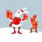 Cute happy smiling white bunny or hare wearing Santa claus clothes holding gift boxis on snowing christmas background