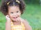 Cute hispanic girl with an afro hairstyle laughing