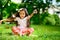 Cute hispanic girl throwing confetti