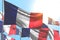 Cute holiday flag 3d illustration - many France flags are waving on blue sky background