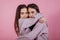 Cute hugs. Two sisters twins standing and posing in the studio with white background