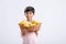 Cute indian/Asian little boy holding Mango basket in hand and giving multiple expressions. isolated over white background