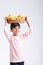 Cute indian/Asian little boy holding Mango basket in hand and giving multiple expressions. isolated over white background