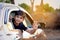 Cute Indian Child waving from car window