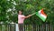 Cute Indian little girl smiling and waving tringa on 15 August