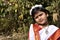 A cute and innocent village girl standing in front of the garden