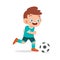 cute kid boy play soccer as striker