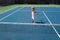 Cute kid boy at the tennis competition. Young boy playing tennis at court.