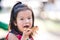 Cute kid girl enjoys eating bread with sweet chocolate. Child aged 4 years old. Empty space for text