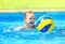 Cute kid playing in water sport games in pool