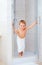 Cute kid ready to wash himself in shower