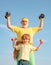Cute kid and senior man exercising with dumbbells. Healthy lifestyle. Father and child training together. Active family