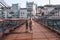 Cute kid walking the Saone River over the pedestrian Saint-Vincent Bridge alone