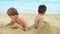 Cute Kids Buried in Sand