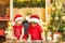 Cute kids in santa hats preparation holiday dinner for family. Two cute boys with santa hat. Two chldren in santa hats