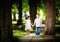 Cute kids walking together in summer park