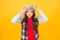 Cute kiss. Small girl enjoy comfortable fashion style. Little child with long hair style wear fur hat on yellow