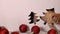 Cute kitten playing in christmas decorations setting