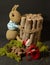 Cute knitted toy bunny with a small bundle of firewood - perfect for easter decorations