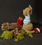 Cute knitted toy bunny with a small bundle of firewood - perfect for easter decorations
