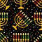 Cute Kwanzaa seamless pattern with seven kinara candles and dots, stars, in traditional African colors - black, red