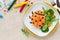 Cute ladybug shaped risotto with fresh salad for kids