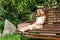 Cute litle barefoot girl sitting on the bench