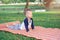 Cute little Asian 18 months / 1 year old toddler baby boy child concentration on practices yoga in Cobra Pose and meditating outdo