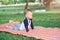 Cute little Asian 18 months / 1 year old toddler baby boy child concentration on practices yoga in Cobra Pose and meditating outdo