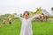 Cute little Asian girl Stretch arms at the fresh green paddy fields