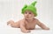 Cute little baby in funny green hat