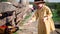 Cute little baby girl feeding goats at countryside animal farm