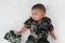 Cute little baby soldier in uniform