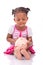 Cute little black girl holding a smiling piggy bank - African ch