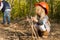 Cute little blond girl in an oversized hardhat