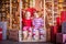 Cute little blonde boy and girl sitting on the Christmas carousel