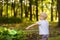 Cute little boy catches butterflies with scoop-net on sunny meadow.Study of nature. Young naturalist